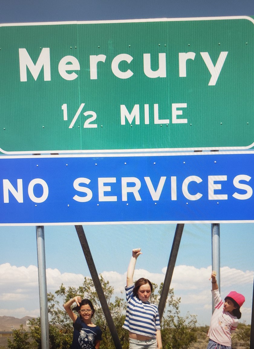 kids in front of mercury sign